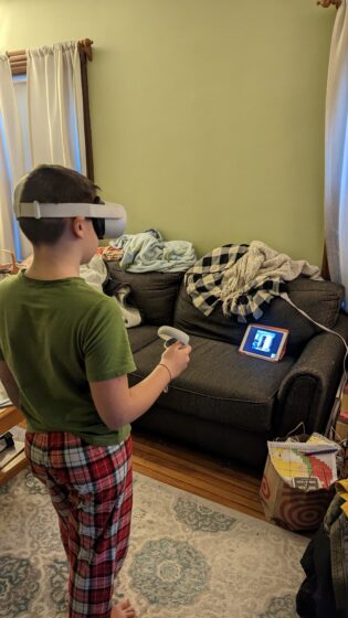 Andy and his friend playing Oculus