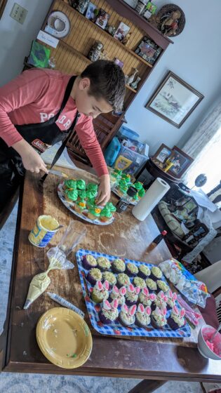 Andy making Leprechaun hat and bunny cupcakes
